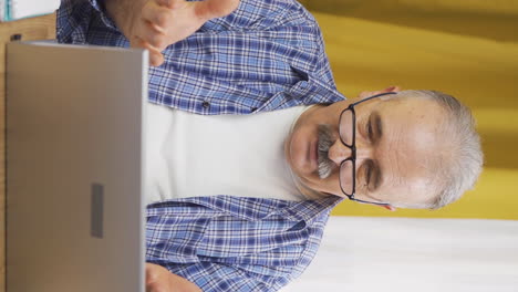 Vertical-video-of-Old-man-sending-wrong-mail-on-laptop.-Can't-get-mail-back.